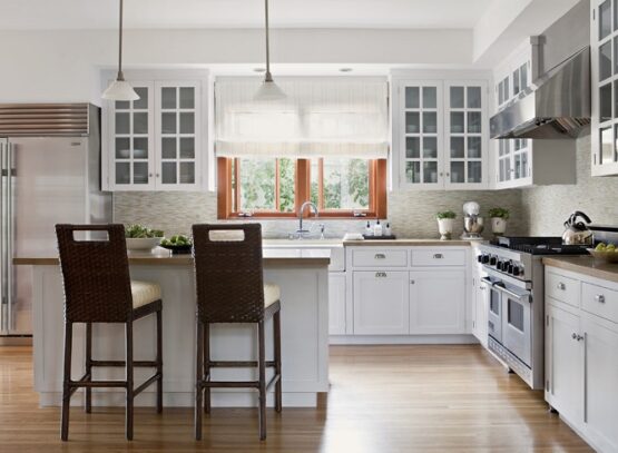white-kitchen-design-glass-front-cabinets-breakfast-bar