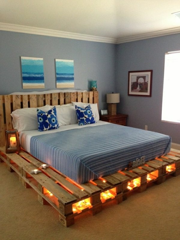 bed from pallets with interesting lighting