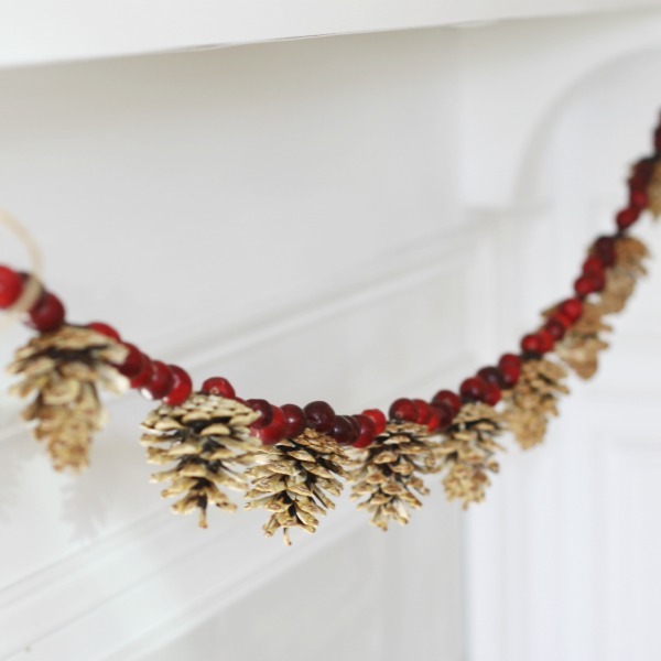 christmas garlands from natural materials pine cones and cranberry