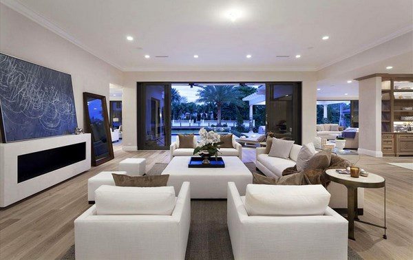 contemporary open plan formal living space with white furniture