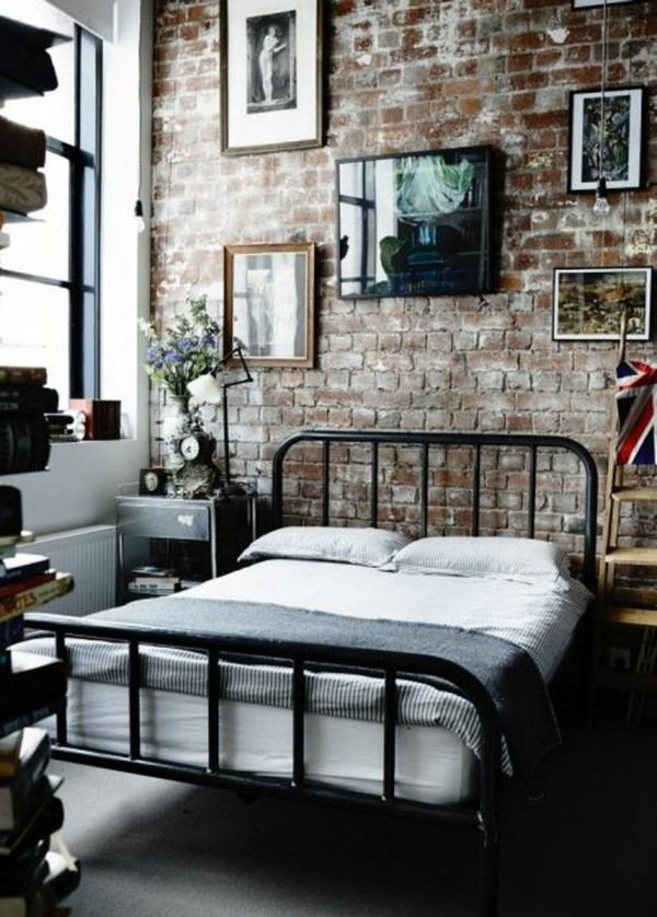 industrial bedroom exposed brick wall metal bed