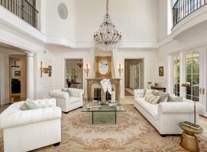 traditional-style-formal-room-with-glass-coffee-table-sofa-fireplace