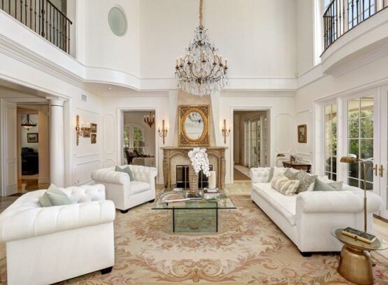 traditional-style-formal-room-with-glass-coffee-table-sofa-fireplace