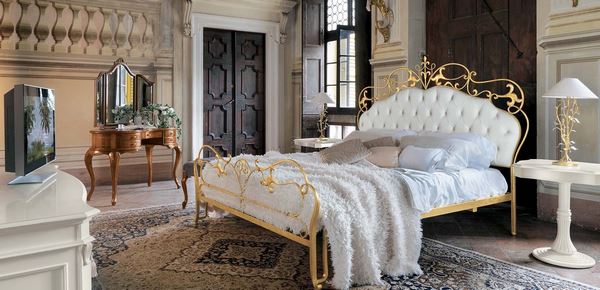 baroque bedroom interior design with gilded bed frame and tufted headboard