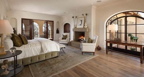 bedroom design ideas wood flooring area rug fireplace