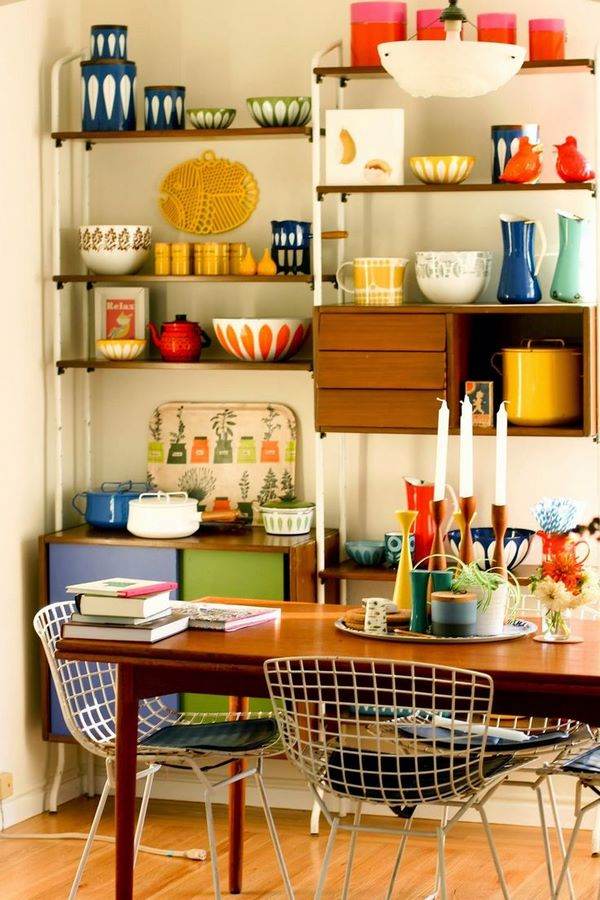 open kitchen shelves wooden dining table metal chairs
