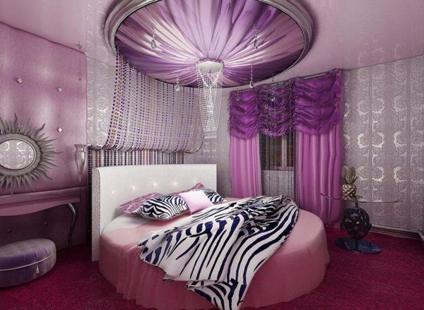 round bed purple pink color scheme in bedroom interior