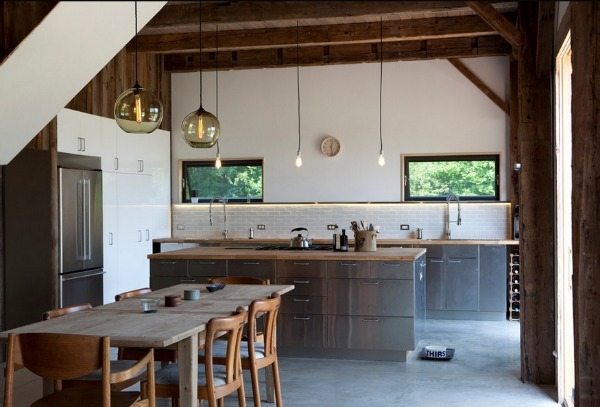 rustic kitchen with stainless steel cabinets exposed ceiling beams