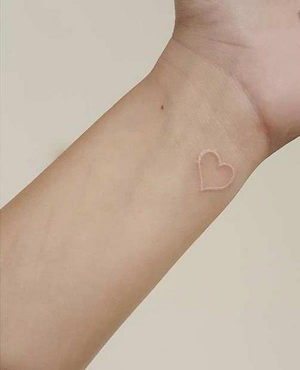small heart tattoo on wrist 
