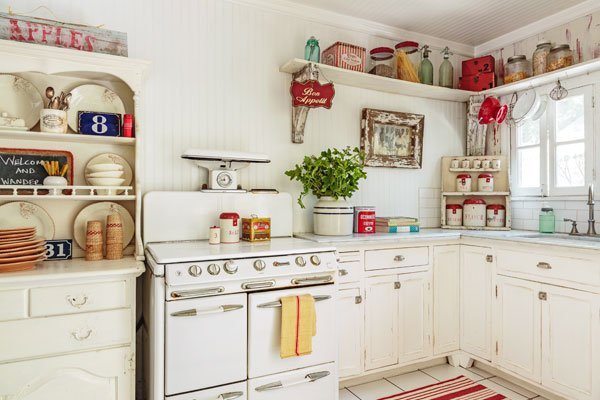 small kitchen in retro style white cabinets and vintage stove