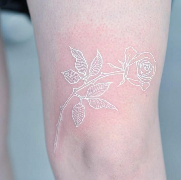 small white rose tattoo thigh tattoo
