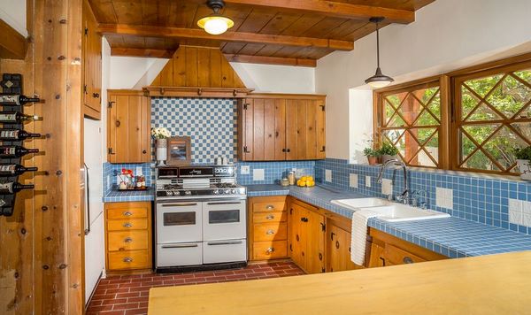 Aqua blue countertop tiles in rustic kitchen