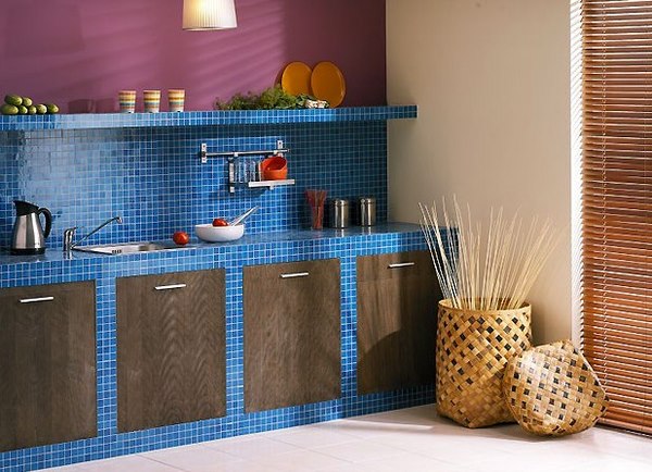 blue mosaic tile countertop and backsplash in kitchen interior