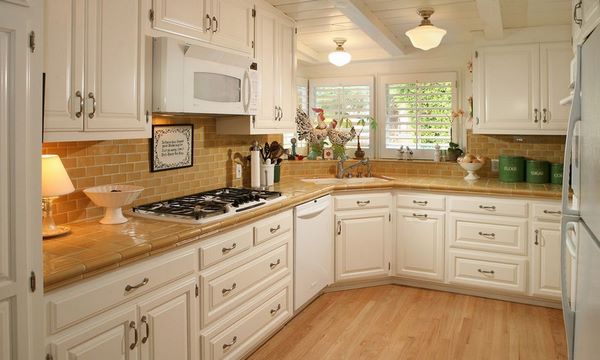 corner kitchen design white cabinets with tiles on countertop