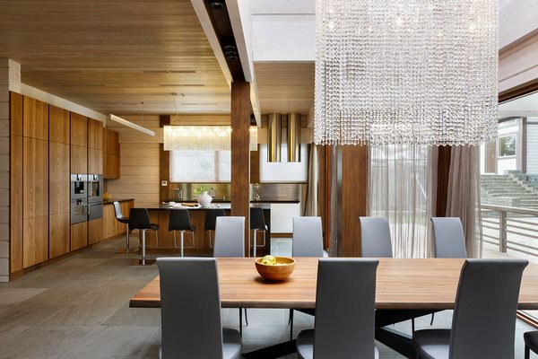 modern dining room design wood ceiling and crystal chandelier
