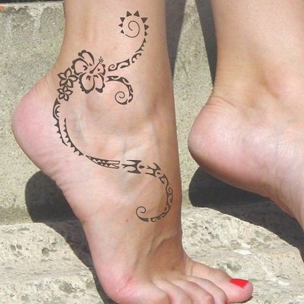 tribal style flower tattoo on ankle