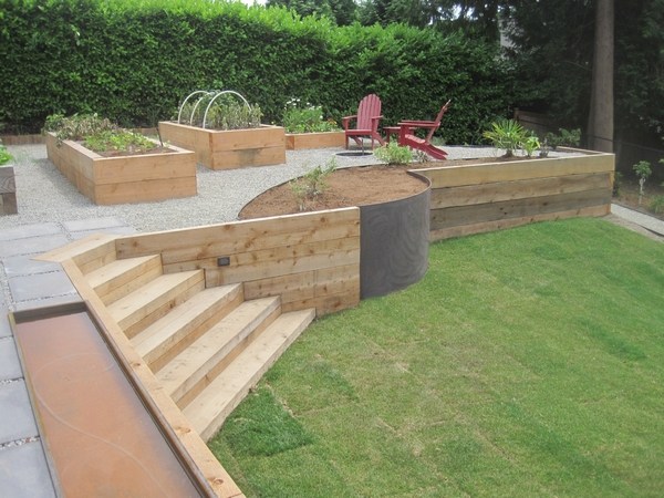 wood retaining wall and raised garden beds