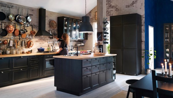 black kitchen cabinets exposed brick wall whitewashed