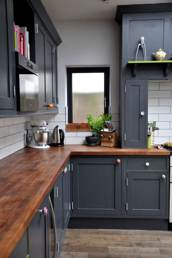 dark kitchen cabinets wood countertops tile backsplash