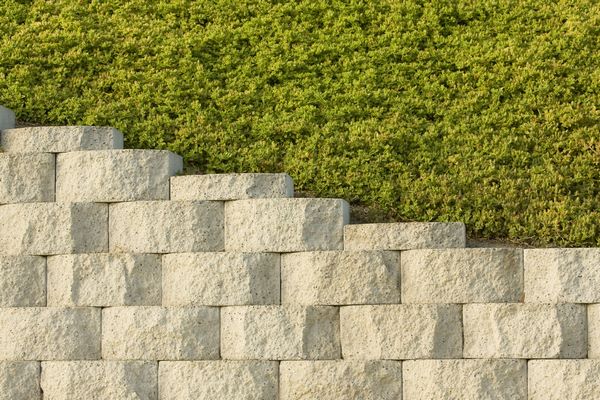 inexpensive retaining wall materials pros and cons