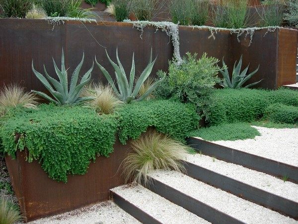 recycled metal sheets retaining wall hill landscaping
