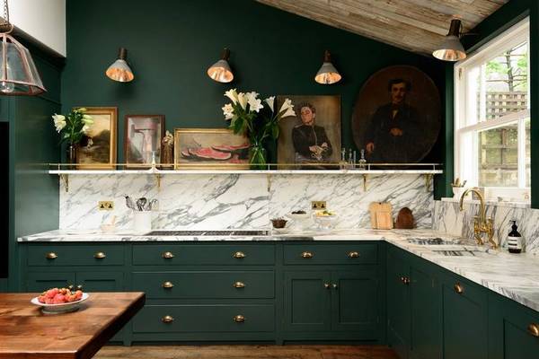 striking kitchen design with dark green cabinets
