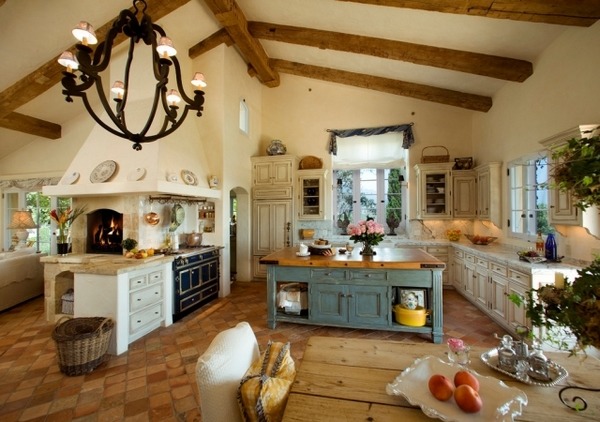 country house kitchen in Mediterranean style marble countertops wrought iron chandelier