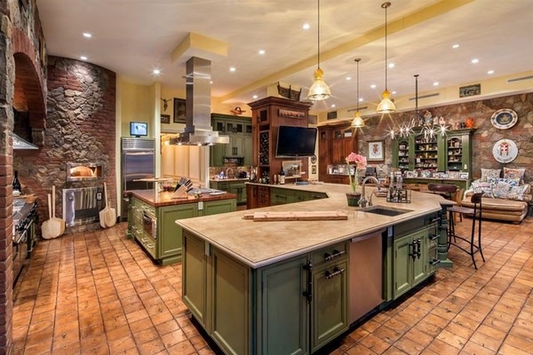 mediterranean style kitchen with limestone countertops and pizza oven