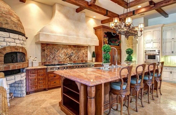 tuscan kitchen with pizza oven and large island