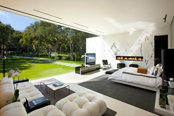 contemporary bedroom design ideas with fireplace and seating area