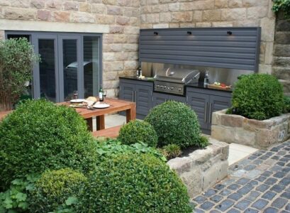 small-backyard-with-outdoor-kitchen-and-dining-furniture