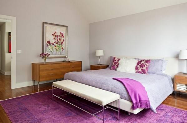 Bedroom with an overdyed rug in purple vintage accents in modern interior