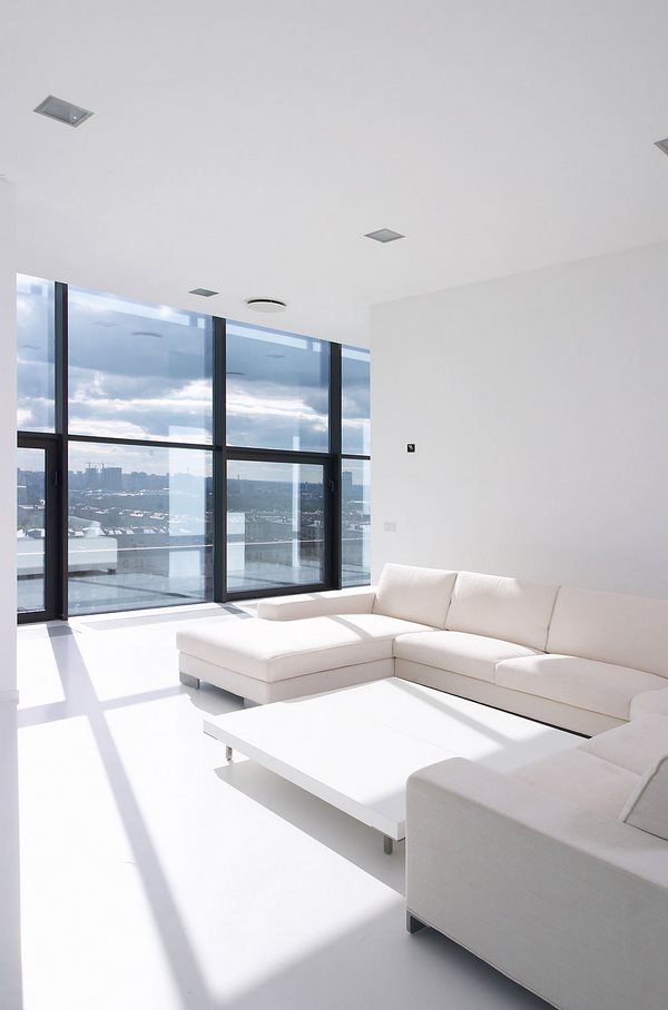 Minimalist Interior white flooring and walls white furniture