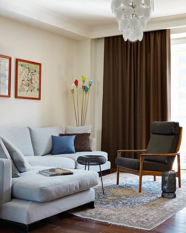 elegant living room decor with corner sofa and vintage carpet