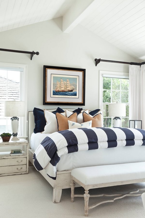 light and white bedroom with beach themed decor