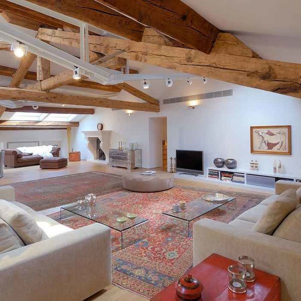 open plan living room decor ideas exposed ceiling beams antique rug