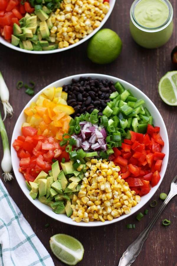 colorful Mexican salad with avocado dressing