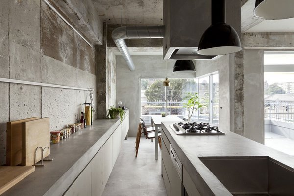 contemporary kitchen design concrete walls floor and cabinets