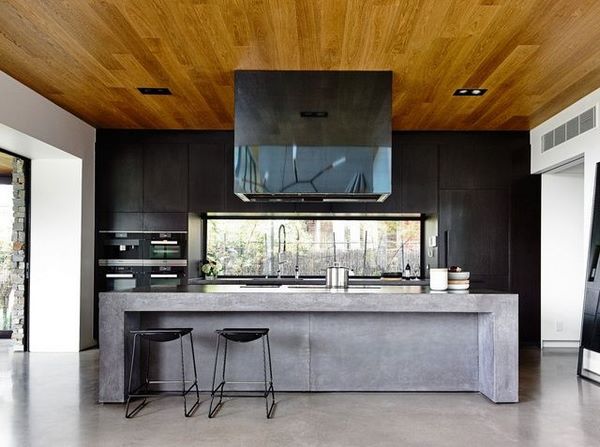 contemporary kitchen large concrete island with seating and storage space