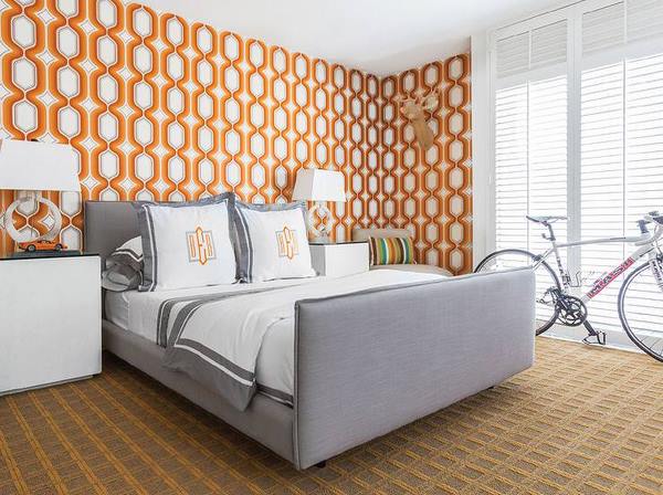 orange accent wall in master bedroom gray upholstered bed