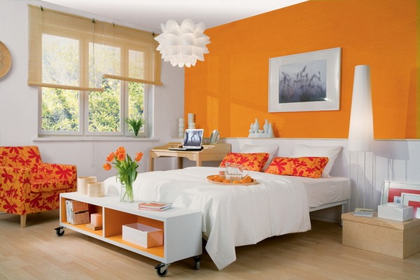 orange accent wall upholstered armchair decorative pillows