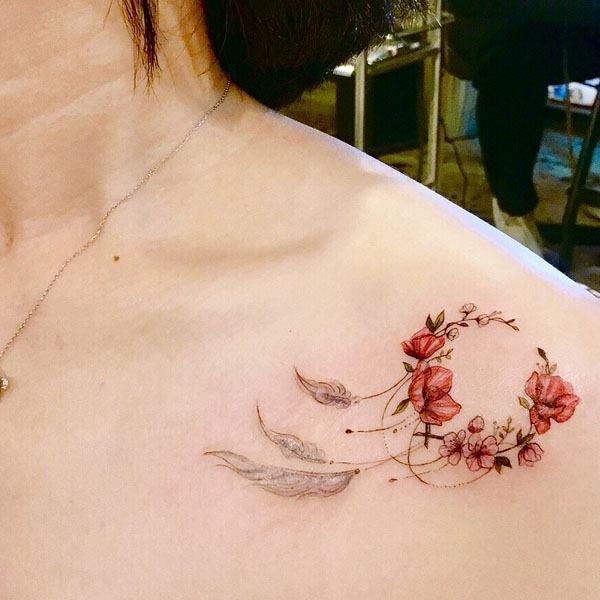 collarbone tattoo for women dreamcatcher and flowers