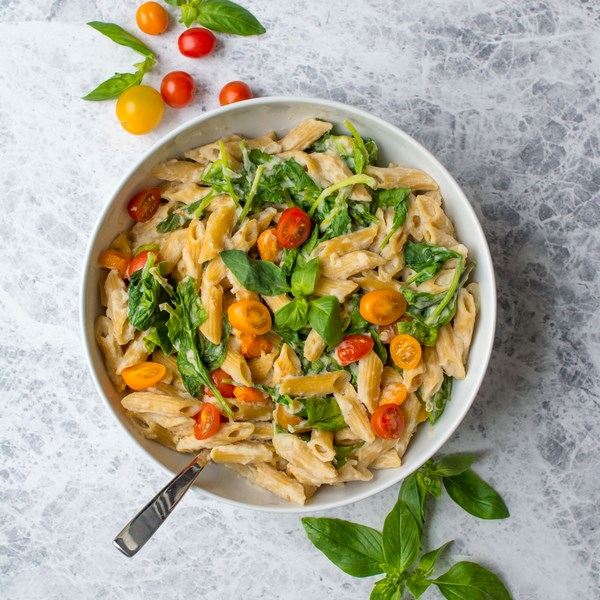 Creamy vegan pasta with tomatoes and basil