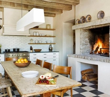 Farmhouse-kitchen-with-fireplace-white-cabinets-and-floor-tiles
