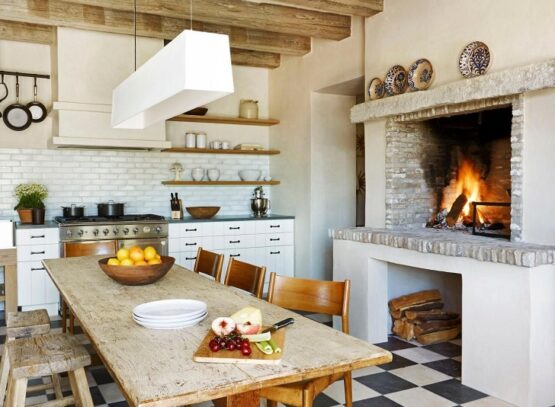 Farmhouse-kitchen-with-fireplace-white-cabinets-and-floor-tiles