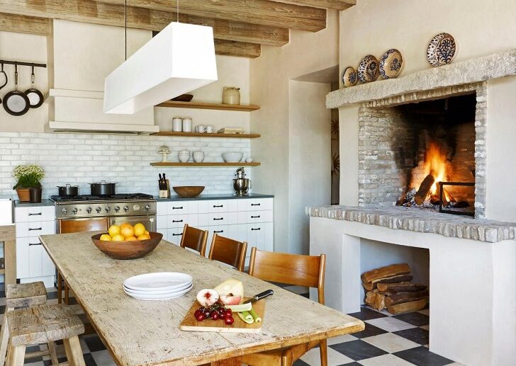 Farmhouse-kitchen-with-fireplace-white-cabinets-and-floor-tiles
