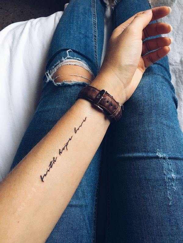 arm inscription tattoo for women faith hope love