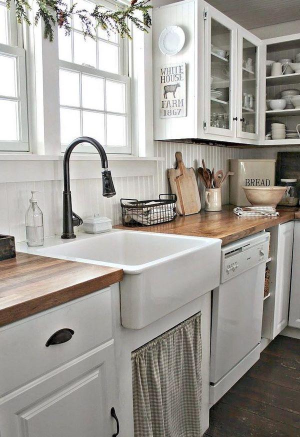 farmhouse sink white kitchen cabinets wood flooring