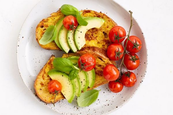 savory toast with avocado and roasted tomatoes