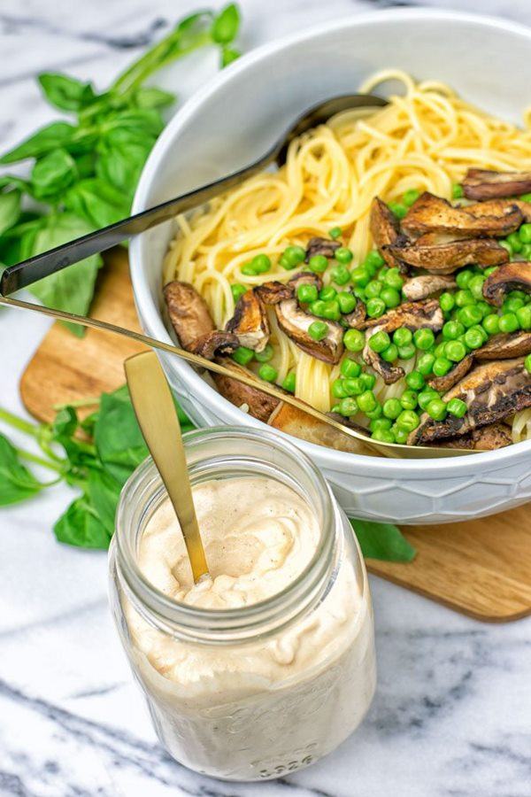 vegan pasta with tahini sauce mushrooms and peas